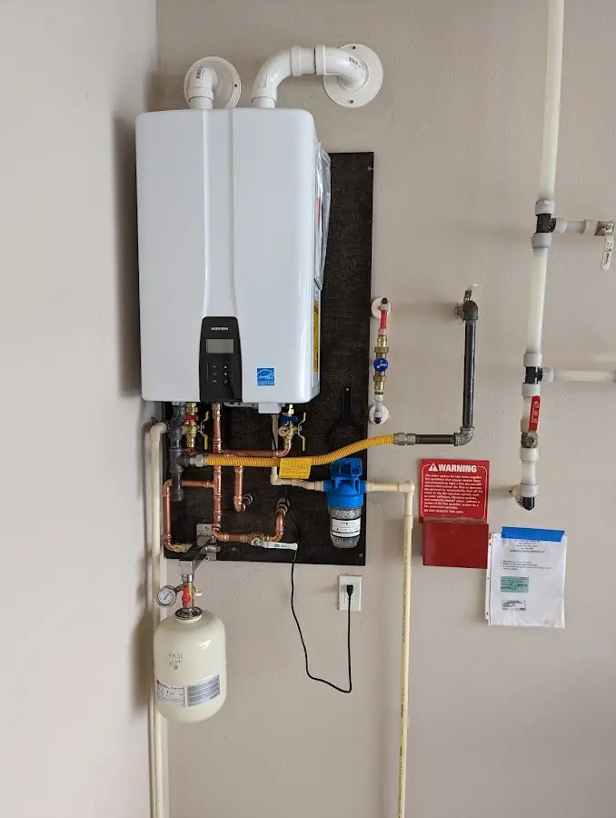 Professional plumber installing copper piping in a Middleburg Heights home